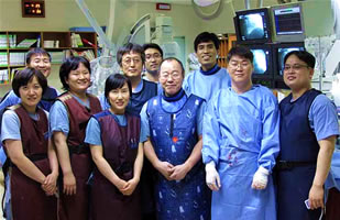 Dr. Saito with cath lab team